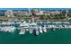 Aerial view of a marina with luxury yachts and waterfront restaurant at 1677 4Th St, Sarasota, FL 34236