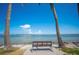 Park bench overlooking tranquil bay waters at 1677 4Th St, Sarasota, FL 34236