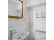 Clean bathroom with white sink and wooden mirror at 1677 4Th St, Sarasota, FL 34236