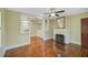Open living room with hardwood floors and built-in shelving at 1677 4Th St, Sarasota, FL 34236