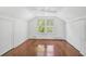 Cozy bedroom with hardwood floors and large windows at 1677 4Th St, Sarasota, FL 34236
