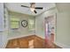 Living room with hardwood floors, window air conditioner, and built-in shelving at 1677 4Th St, Sarasota, FL 34236