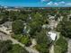 Aerial view showcasing a home nestled in a tree-lined neighborhood at 1677 4Th St, Sarasota, FL 34236