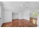 Bright living room with hardwood floors and ceiling fan at 1677 4Th St, Sarasota, FL 34236