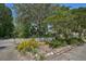 Home with a white picket fence and mature trees in the front yard at 1677 4Th St, Sarasota, FL 34236