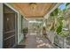 Inviting front porch with wooden flooring and white railings at 1677 4Th St, Sarasota, FL 34236