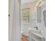 Simple bathroom with white vanity, shower, and tile floor at 1677 4Th St, Sarasota, FL 34236