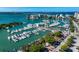 Aerial view of a marina with numerous boats and waterfront property at 1677 4Th St, Sarasota, FL 34236