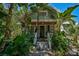 Charming bungalow with lush landscaping and a welcoming porch at 1677 4Th St, Sarasota, FL 34236