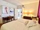 Guest bedroom with twin beds and built-in desk at 1065 Gulf Of Mexico Dr # 302, Longboat Key, FL 34228