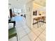 Open kitchen with breakfast bar and view into the living area at 1065 Gulf Of Mexico Dr # 302, Longboat Key, FL 34228