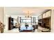 Open living room with a view of the balcony at 1065 Gulf Of Mexico Dr # 302, Longboat Key, FL 34228