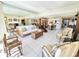 Bright living room with ample seating and large mirror at 1065 Gulf Of Mexico Dr # 302, Longboat Key, FL 34228