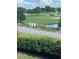 Property view showcasing a green golf course at 1065 Gulf Of Mexico Dr # 302, Longboat Key, FL 34228