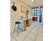 Bright entryway with vintage console table at 1065 Gulf Of Mexico Dr # 302, Longboat Key, FL 34228