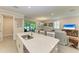 Open concept kitchen with island and view of living room at 325 Maraviya Blvd, Nokomis, FL 34275