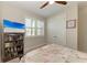 Bright bedroom with double doors and a bookshelf at 325 Maraviya Blvd, Nokomis, FL 34275