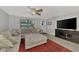 Living room with sectional sofa and large TV at 3917 Cochise Ter, Sarasota, FL 34233