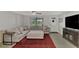 Living room with sectional sofa and large TV at 3917 Cochise Ter, Sarasota, FL 34233
