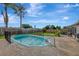 Large backyard with a fenced pool and grassy area at 3917 Cochise Ter, Sarasota, FL 34233
