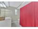 Clean bathroom with red shower curtain, granite countertop, and a window at 3917 Cochise Ter, Sarasota, FL 34233