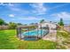 Large backyard with a fenced pool and grassy area at 3917 Cochise Ter, Sarasota, FL 34233