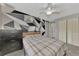 Bedroom with geometric wall art, gray walls, and a window at 3917 Cochise Ter, Sarasota, FL 34233