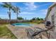 Enjoy this relaxing pool area, complete with lounge chairs at 3917 Cochise Ter, Sarasota, FL 34233