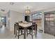 Charming dining area with a square table and built-in shelving at 3917 Cochise Ter, Sarasota, FL 34233