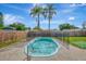 Refreshing kidney-shaped pool with safety fence, perfect for summer at 3917 Cochise Ter, Sarasota, FL 34233