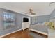 Bright main bedroom with wood floors, a ceiling fan, and access to a pool at 3917 Cochise Ter, Sarasota, FL 34233