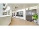 Apartment hallway with tiled floors and a dark brown door at 1255 N Gulfstream Ave # 1003, Sarasota, FL 34236