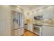 Stainless steel appliances and granite countertops in this well-equipped kitchen at 1255 N Gulfstream Ave # 1003, Sarasota, FL 34236