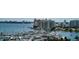 Waterfront view of a luxurious marina with many boats and yachts at 1255 N Gulfstream Ave # 1003, Sarasota, FL 34236