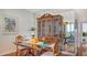 Elegant dining room showcasing hardwood floors and china cabinet at 1255 N Gulfstream Ave # 1003, Sarasota, FL 34236