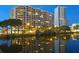 Building exterior with water reflection at night at 1255 N Gulfstream Ave # 1003, Sarasota, FL 34236