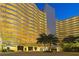 Modern building exterior with palm trees and lights at 1255 N Gulfstream Ave # 1003, Sarasota, FL 34236