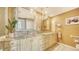 Elegant bathroom with double sinks and granite countertops at 1255 N Gulfstream Ave # 1003, Sarasota, FL 34236
