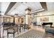 Condo lobby with seating, large windows, and modern decor at 1255 N Gulfstream Ave # 1003, Sarasota, FL 34236