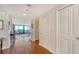 Bright entryway with hardwood floors and access to living room at 1255 N Gulfstream Ave # 1003, Sarasota, FL 34236