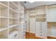 Large walk-in closet with ample shelving and drawers at 1255 N Gulfstream Ave # 1003, Sarasota, FL 34236