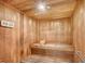 Relaxing sauna with wooden walls and bench at 1255 N Gulfstream Ave # 1003, Sarasota, FL 34236