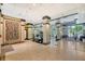 Bright condo lobby with glass walls, seating, and modern art at 1255 N Gulfstream Ave # 1003, Sarasota, FL 34236