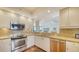 Updated kitchen, featuring stainless steel appliances and granite countertops at 1255 N Gulfstream Ave # 1003, Sarasota, FL 34236