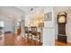 Breakfast bar with two stools, hardwood floors at 1255 N Gulfstream Ave # 1003, Sarasota, FL 34236