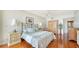 Spacious bedroom with hardwood floors and a large bed at 1255 N Gulfstream Ave # 1003, Sarasota, FL 34236