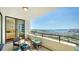 Spacious balcony with outdoor furniture and stunning water views at 1255 N Gulfstream Ave # 1003, Sarasota, FL 34236