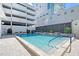 Inviting community pool with ample deck space at 1255 N Gulfstream Ave # 1003, Sarasota, FL 34236