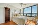 Bright bedroom with water views and hardwood floors at 1255 N Gulfstream Ave # 1003, Sarasota, FL 34236