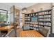 Well-lit common area with bookshelves and seating at 1255 N Gulfstream Ave # 1003, Sarasota, FL 34236